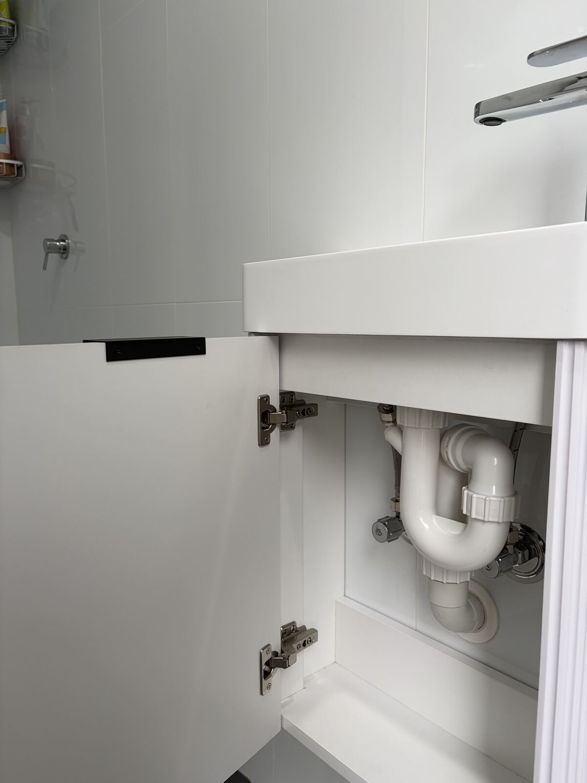 Close up of vanity P-trap plumbing